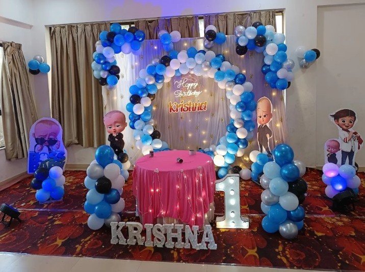 Boss Baby themed first birthday for Krishna with heart balloon arch