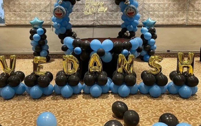 Doraemon themed birthday balloon arch with name letters for Vedansh