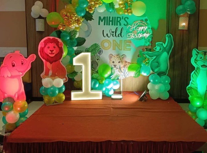 Wild one jungle theme first birthday for Mihir with glowing numeral