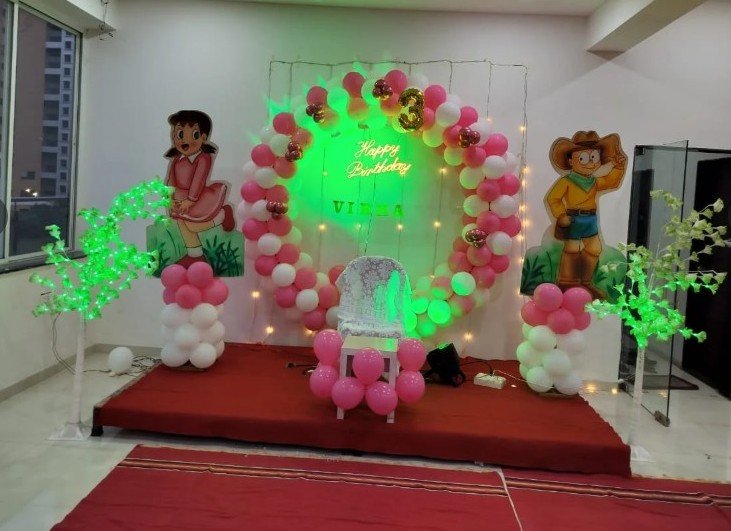 Pink and white balloon ring third birthday for Vibha with neon sign