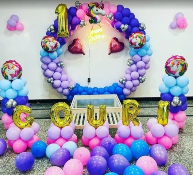 Pastel unicorn themed first birthday balloon ring for Gouri
